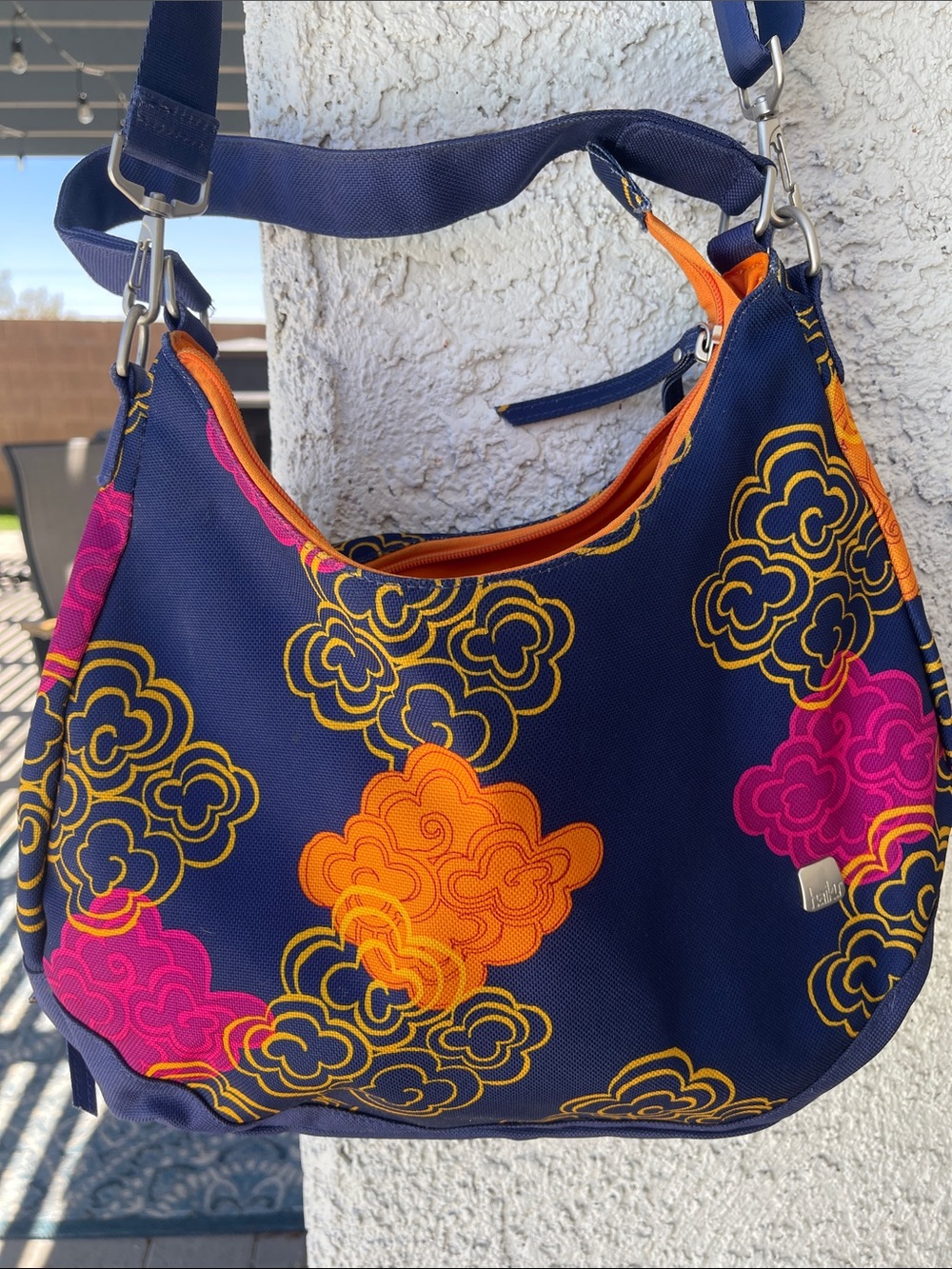 Stylish Navy Floral Hobo Bag with Orange & Pink Accents